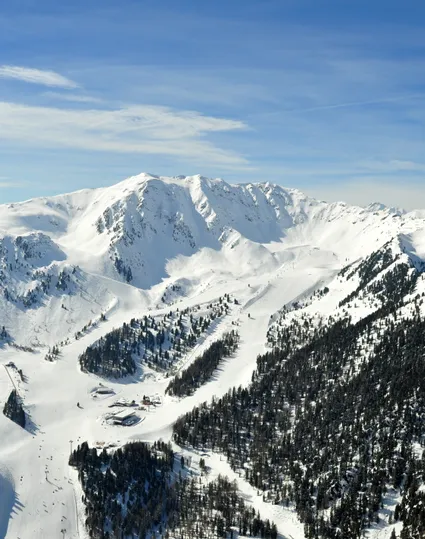 Aerial view of the snow-covered Klausberg and Speikboden ski resort with slopes and lifts